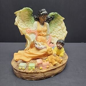 Sitting African American Guardian Angel Figurine with a baby and a bear VINTAGE